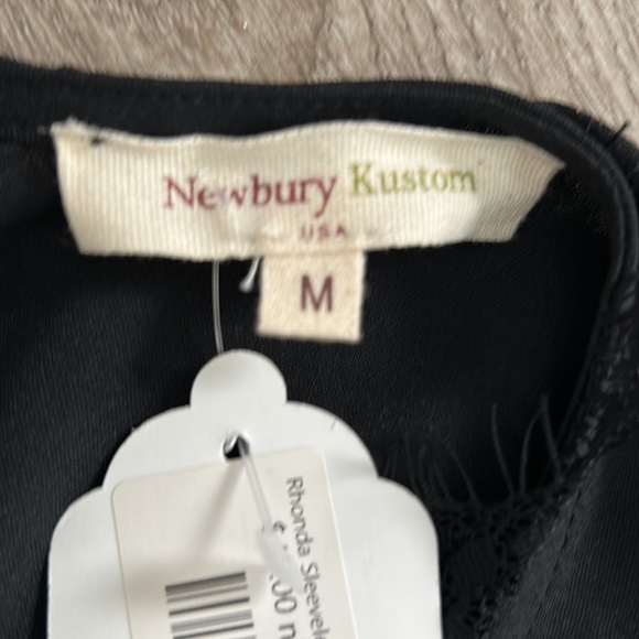 Black pleated front romper with lace trim sleeves and neck line - Picture 6 of 10